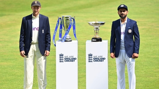 England's captain Joe Root (L) and India's captain Virat Kohli (R) pose with the Pataudi Trophy (CR) and the Test series trophy (CL) at Trent Bridge Cricket Ground in Nottingham.(Twitter)