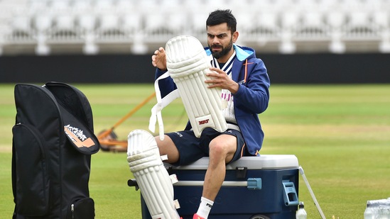 India captain Virat Kohli pads up during net practice prior to the first Test Match between England and India at Trent Bridge cricket ground in Nottingham, England. (AP)