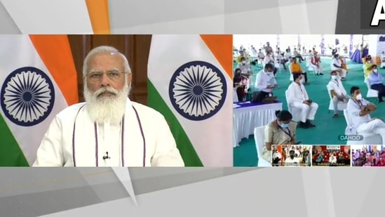 PM Modi virtually interacts with beneficiaries of Pradhan Mantri Garib Kalyan Anna Yojana in Gujarat. (Image: ANI Twitter)