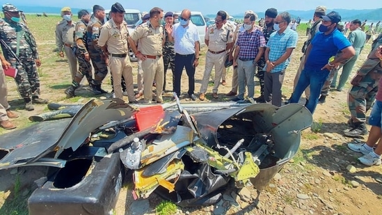 Police personnel inspect the site after a helicopter of the army crashed into the Ranjit Sagar Dam lake in Kathua on Tuesday. PTI(PTI) Police personnel inspect the site after a helicopter of the army crashed into the Ranjit Sagar Dam lake in Kathua on Tuesday. PTI(PTI)