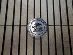 A Reserve Bank of India (RBI) logo is seen at the entrance gate of its headquarters in Mumbai. 