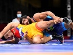 Tokyo 2020 Olympics - Wrestling - Freestyle - Men's 57kg - Last 16 - Makuhari Messe Hall A, Chiba, Japan - August 4, 2021. Oscar Eduardo Tigreros Urbano of Colombia in action against Ravi Kumar of India 