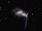 The post was shared with a picture of three sparkling intertwined galaxies shaped like an axe.