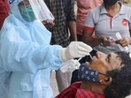 A health worker collects swab samples for Covid-19 tests in Nagpur. A health worker collects swab samples for Covid-19 tests in Nagpur.