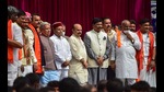 Karnataka Governor Thawar Chand Gehlot and chief minister Basavaraj Bommai with newly inducted ministers during swearing-in ceremony to form the Cabinet at Raj Bhavan in Bengaluru on Wednesday. (PTI) Karnataka Governor Thawar Chand Gehlot and chief minister Basavaraj Bommai with newly inducted ministers during swearing-in ceremony to form the Cabinet at Raj Bhavan in Bengaluru on Wednesday. (PTI)