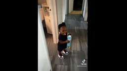 The image shows the little girl whose dad caught her stealing snacks.