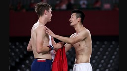 Tokyo Olympics 2020: The image shows Olympic champion Viktor Axelse of Denmark with his opponent Chen Long of China.