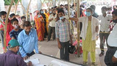 People queue up for Covid test before going to the OPD of Balrampur Hospital. Now, Covid test is a must for patients before entering the OPD. (HT Photo) People queue up for Covid test before going to the OPD of Balrampur Hospital. Now, Covid test is a must for patients before entering the OPD. (HT Photo)
