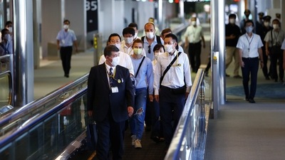 Belarusian Sprinter Krystsina Tsimanouskaya who took refuge in the Polish embassy in Tokyo, arrives for a flight to Vienna at Narita International Airport in Narita, east of Tokyo, Japan August 4, 2021. (REUTERS)