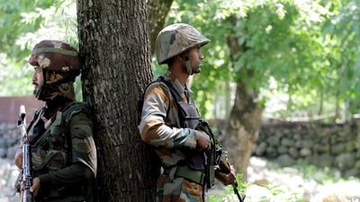 Army personnel take position during an encounter at Shokbaba forest, in Bandipora. (ANI Photo) Army personnel take position during an encounter at Shokbaba forest, in Bandipora. (ANI Photo)