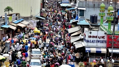 Despite the state being at the tipping point, people crowd a market at the Avenue Road in Bengaluru on Sunday. (ANI Photo) Despite the state being at the tipping point, people crowd a market at the Avenue Road in Bengaluru on Sunday. (ANI Photo)
