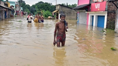 People walk through the floodwater due to the heavy rainfall at Udayanarayanpur, Howrah, in Kolkata on Tuesday. (ANI Photo) People walk through the floodwater due to the heavy rainfall at Udayanarayanpur, Howrah, in Kolkata on Tuesday. (ANI Photo)