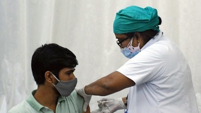 A beneficiary receives a dose of the Covid-19 vaccine at Nair hospital in Mumbai on Tuesday. (ANI Photo) A beneficiary receives a dose of the Covid-19 vaccine at Nair hospital in Mumbai on Tuesday. (ANI Photo)