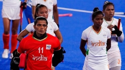 India goalkeeper Savita (11) and her teammates walk off the field after losing their women's field hockey semi-final match against Argentina at the 2020 Summer Olympics, Wednesday, Aug. 4, 2021, in Tokyo, Japan. (AP Photo/John Locher) (AP) India goalkeeper Savita (11) and her teammates walk off the field after losing their women's field hockey semi-final match against Argentina at the 2020 Summer Olympics, Wednesday, Aug. 4, 2021, in Tokyo, Japan. (AP Photo/John Locher) (AP)