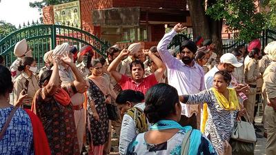 Teachers protesting outside the Punjab education secretary’s office in Mohali’s Phase 8 on Wednesday. (HT Photo)
