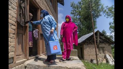 A 'door-to-door' Covid-19 vaccination team speaks to a resident during a vaccination drive at a village in the Budgam district of Jammu and Kashmir. (Bloomberg) A 'door-to-door' Covid-19 vaccination team speaks to a resident during a vaccination drive at a village in the Budgam district of Jammu and Kashmir. (Bloomberg)