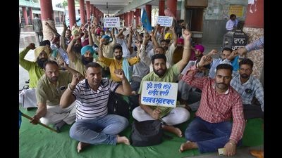 Members of the Punbus Contractual Employees’ Union protesting at the Ludhiana bus stand on Wednesday. (Gurpreet Singh/HT) Members of the Punbus Contractual Employees’ Union protesting at the Ludhiana bus stand on Wednesday. (Gurpreet Singh/HT)