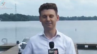 The image shows reporter Jakob Emerson with the car in the background. (Twitter/@BrianMFloyd)
