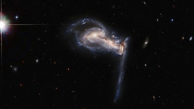 The post was shared with a picture of three sparkling intertwined galaxies shaped like an axe. (Photo: ESA/Hubble & NASA, J. Dalcanton)