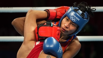 Tokyo: India's Lovlina Borgohain (blue) exchanges punches with Busenaz Surmeneli of Turkey in the women's welterweight (64-69kg) category boxing semifinal match, at the Summer Olympics 2020, in Tokyo, Wednesday, Aug 4, 2021. Borgohain lost the match. (PTI) Tokyo: India's Lovlina Borgohain (blue) exchanges punches with Busenaz Surmeneli of Turkey in the women's welterweight (64-69kg) category boxing semifinal match, at the Summer Olympics 2020, in Tokyo, Wednesday, Aug 4, 2021. Borgohain lost the match. (PTI)