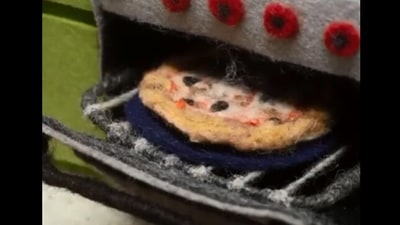 The image is taken from the stop motion video of the pizza being prepared using wool. (Reddit/@solateor)