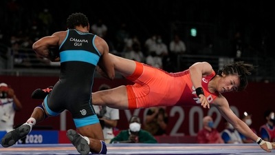Japan's Risako Kawai, right, and Guinea's Fatoumata Yarie Camara compete during the women's 57kg freestyle wrestling match at the 2020 Summer Olympics, Wednesday, Aug. 4, 2021 in Chiba, Japan. Camara is the only Guinean athlete to qualify for these Games. (AP Photo/Aaron Favila) (AP) Japan's Risako Kawai, right, and Guinea's Fatoumata Yarie Camara compete during the women's 57kg freestyle wrestling match at the 2020 Summer Olympics, Wednesday, Aug. 4, 2021 in Chiba, Japan. Camara is the only Guinean athlete to qualify for these Games. (AP Photo/Aaron Favila) (AP)