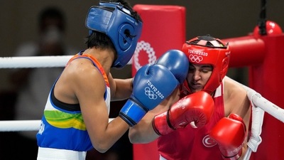 Lovlina Borgohain, of India, left, punches Busenaz Surmeneli, of Turkey, during their women's welter weight 64-69kg semifinal boxing match at the 2020 Summer Olympics, Wednesday, Aug. 4, 2021, in Tokyo, Japan. (AP Photo/Themba Hadebe) (AP) Lovlina Borgohain, of India, left, punches Busenaz Surmeneli, of Turkey, during their women's welter weight 64-69kg semifinal boxing match at the 2020 Summer Olympics, Wednesday, Aug. 4, 2021, in Tokyo, Japan. (AP Photo/Themba Hadebe) (AP)