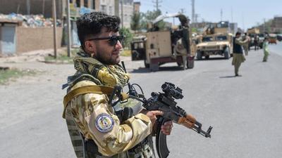 A file photo of an Afghan National Army commando standing guard on a road amid ongoing fighting between Taliban and Afghan security forces in the Enjil district of Herat province. (AFP/FILE) A file photo of an Afghan National Army commando standing guard on a road amid ongoing fighting between Taliban and Afghan security forces in the Enjil district of Herat province. (AFP/FILE)