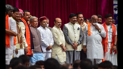 Karnataka Governor Thawar Chand Gehlot and chief minister Basavaraj Bommai with newly inducted ministers during swearing-in ceremony to form the Cabinet at Raj Bhavan in Bengaluru on Wednesday. (PTI) Karnataka Governor Thawar Chand Gehlot and chief minister Basavaraj Bommai with newly inducted ministers during swearing-in ceremony to form the Cabinet at Raj Bhavan in Bengaluru on Wednesday. (PTI)