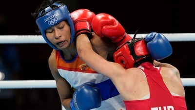 Lovlina Borgohain, of India, left, and Busenaz Surmeneli, of Turkey, exchange punches during their women's welter weight 64-69kg semifinal boxing match at the 2020 Summer Olympics, Wednesday, Aug. 4, 2021, in Tokyo, Japan. (AP Photo/Themba Hadebe) (AP) Lovlina Borgohain, of India, left, and Busenaz Surmeneli, of Turkey, exchange punches during their women's welter weight 64-69kg semifinal boxing match at the 2020 Summer Olympics, Wednesday, Aug. 4, 2021, in Tokyo, Japan. (AP Photo/Themba Hadebe) (AP)