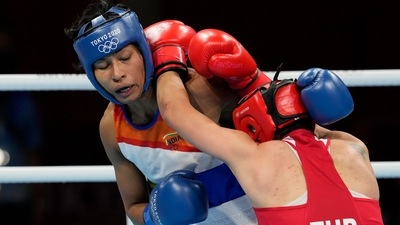 Lovlina Borgohain, of India, left, and Busenaz Surmeneli, of Turkey, exchange punches during their women's welter weight 64-69kg semifinal boxing match at the 2020 Summer Olympics, Wednesday, Aug. 4, 2021, in Tokyo, Japan. (AP) Lovlina Borgohain, of India, left, and Busenaz Surmeneli, of Turkey, exchange punches during their women's welter weight 64-69kg semifinal boxing match at the 2020 Summer Olympics, Wednesday, Aug. 4, 2021, in Tokyo, Japan. (AP)
