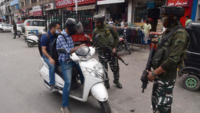 Security personnel check the ID of a motorist ahead of the second anniversary of abrogation of Article 370, in Srinagar on Wednesday. (ANI) Security personnel check the ID of a motorist ahead of the second anniversary of abrogation of Article 370, in Srinagar on Wednesday. (ANI)