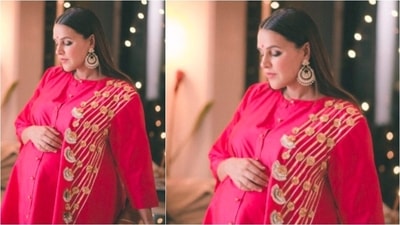 This was Neha's second Diwali outfit. Neha looked drop-dead gorgeous as she posed in a bright red kurta by Abu Jani Sandeep Khosla. (Instagram/@nehadhupia) This was Neha's second Diwali outfit. Neha looked drop-dead gorgeous as she posed in a bright red kurta by Abu Jani Sandeep Khosla. (Instagram/@nehadhupia)