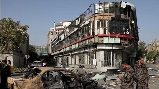 Members of Afghan security forces keep watch at the site of Tuesday's night-time car bomb blast in Kabul, Afghanistan on August 4. (REUTERS)