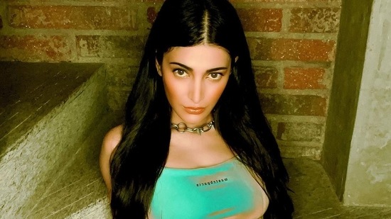 Shruti had her dark hair open, accessorizing her look with a spiky, link chain around her neck and white sneakers, she wore black nail paint on her fingernails.(Instagram)