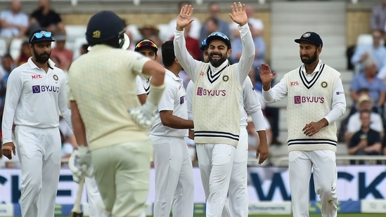 India's captain Virat Kohli, second right, and teammates celebrate the dismissal of England's Ollie Robinson(AP)