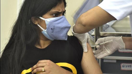 A beneficiary gets inoculated against Covid-19 at Nair Hospital. (Satish Bate/HT PHOTO)