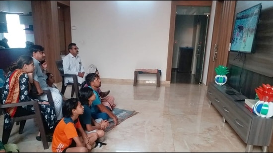 Neeraj’s family watching live telecast of his performance at his native village on Wednesday morning. (HT Photo)