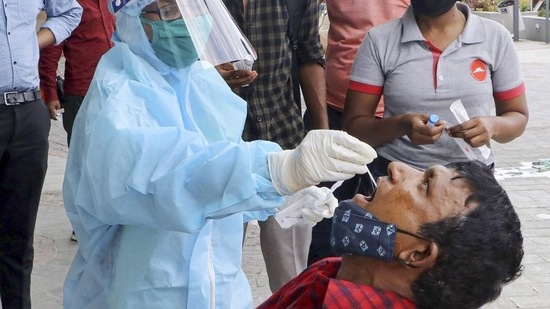 A health worker collects swab samples for Covid-19 tests in Nagpur.(PTI File Photo)