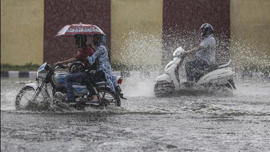 Motorists wade through a waterlogged area during rainfall in Jammu. (File photo) Motorists wade through a waterlogged area during rainfall in Jammu. (File photo)