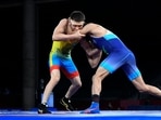 Nurislam Sanayev of Kazakhstan in action against Ravi Kumar of India REUTERS/Piroschka Van De Wouw