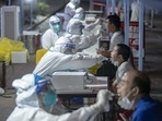 This photo taken on August 3, 2021, shows residents receiving nucleic acid tests for the coronavirus in Wuhan in China's central Hubei province.(File Photo / AFP) This photo taken on August 3, 2021, shows residents receiving nucleic acid tests for the coronavirus in Wuhan in China's central Hubei province.(File Photo / AFP)