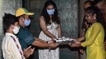 Kajol cutting her birthday cake with her fans. Kajol cutting her birthday cake with her fans.