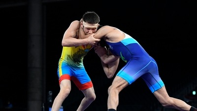 Nurislam Sanayev of Kazakhstan in action against Ravi Kumar of India REUTERS/Piroschka Van De Wouw (REUTERS)