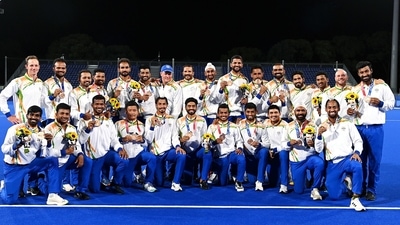 Indian Men's Hockey players pose for a photo with their bronze medal Indian Men's Hockey players pose for a photo with their bronze medal