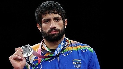 India's Ravi Dahiya holds his silver medal during the medal ceremony of the men's freestyle 57kg wrestling in Tokyo Olympic 2020 India's Ravi Dahiya holds his silver medal during the medal ceremony of the men's freestyle 57kg wrestling in Tokyo Olympic 2020