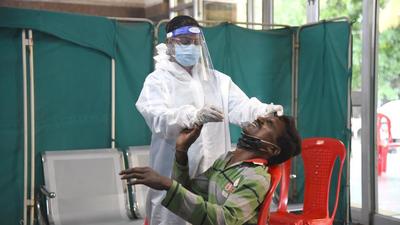 Healthcare worker collects swab sample at NMMC Hospital, Vashi. (HT PHOTO) Healthcare worker collects swab sample at NMMC Hospital, Vashi. (HT PHOTO)