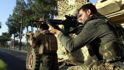 Afghan security personnel take a position during fight against Taliban in Herat province, west of Kabul, Afghanistan, on Tuesday. (AP) Afghan security personnel take a position during fight against Taliban in Herat province, west of Kabul, Afghanistan, on Tuesday. (AP)