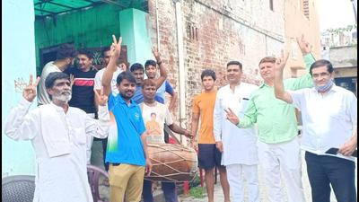 Friends and neighbours gather outside hockey player Sumit Kumar’s house at Kurad village in Sonepat district of Haryana after the Team India victory at the Tokyo Olympics on Thursday. (HT Photo) Friends and neighbours gather outside hockey player Sumit Kumar’s house at Kurad village in Sonepat district of Haryana after the Team India victory at the Tokyo Olympics on Thursday. (HT Photo)