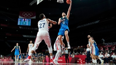 Slovenia's Jaka Blazic (11) drives to the basket over France's Rudy Gobert (27) during a men's basketball semifinal round game at the 2020 Summer Olympics, Thursday, Aug. 5, 2021, in Saitama, Japan. (AP Photo/Charlie Neibergall) (AP) Slovenia's Jaka Blazic (11) drives to the basket over France's Rudy Gobert (27) during a men's basketball semifinal round game at the 2020 Summer Olympics, Thursday, Aug. 5, 2021, in Saitama, Japan. (AP Photo/Charlie Neibergall) (AP)